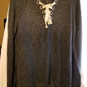 Nice sweater,tie ribbon at front in creme color .